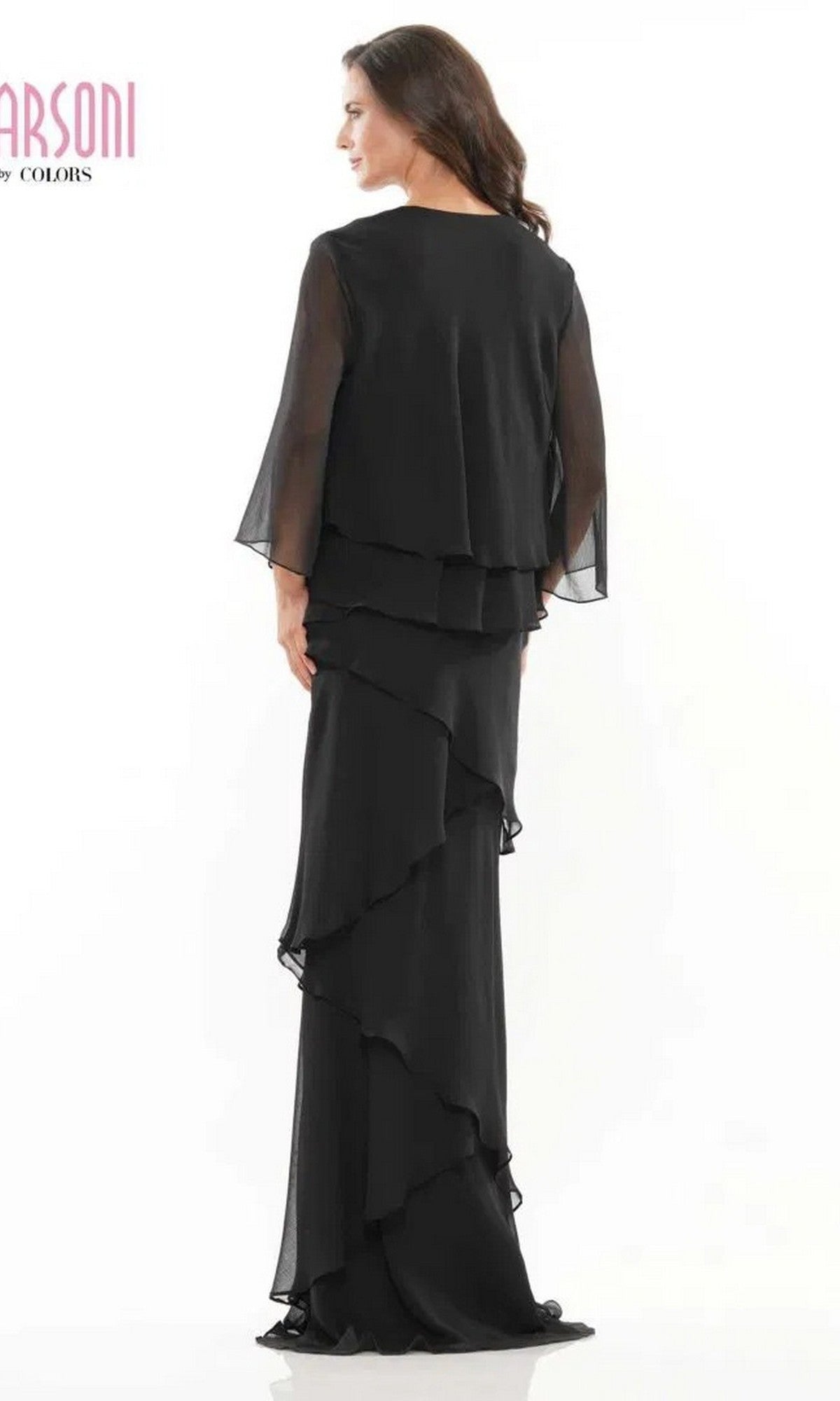 A woman stands slightly turned against a plain white background, wearing the Long Formal Dress: Marsoni M309—an elegant black chiffon evening gown featuring sheer sleeves.